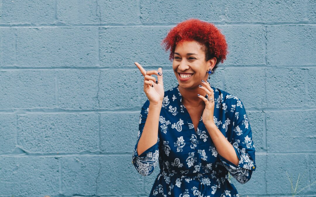 woman smiling and pointing at something