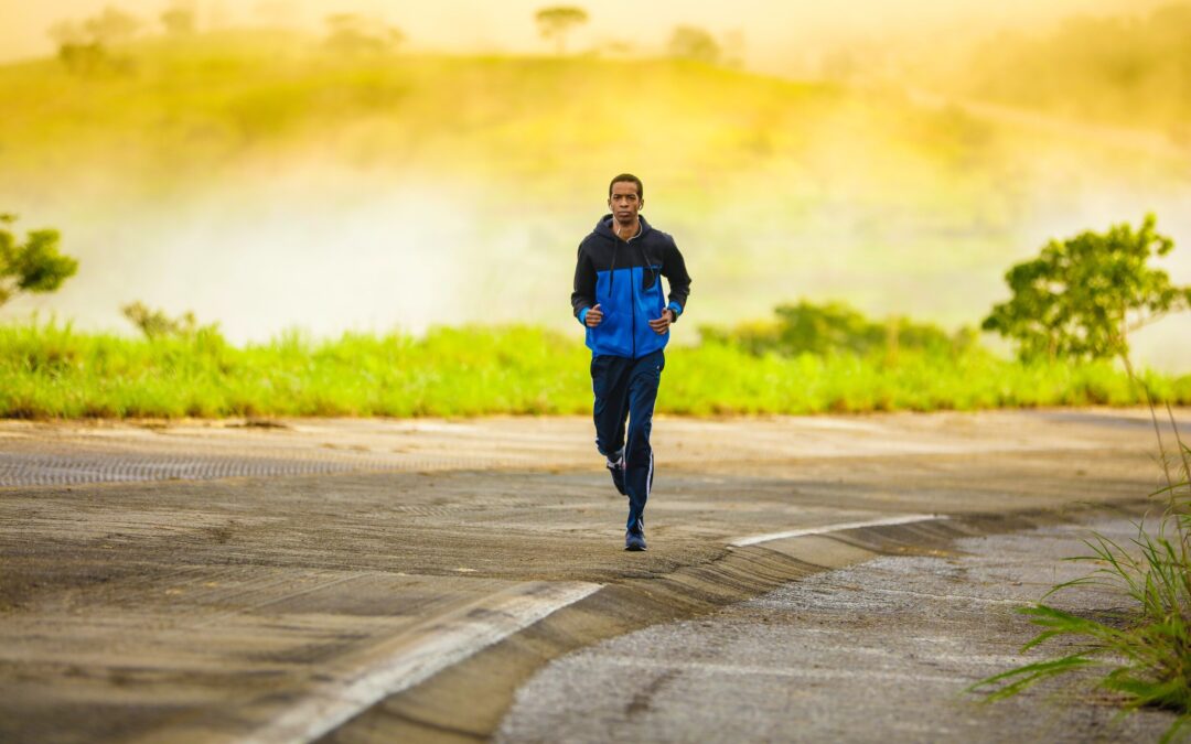 runner in a blue and black jacket